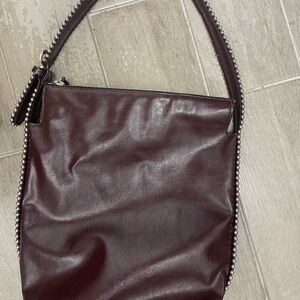 Beautiful burgundy handbag, slight damage on faux leather from beads indenting